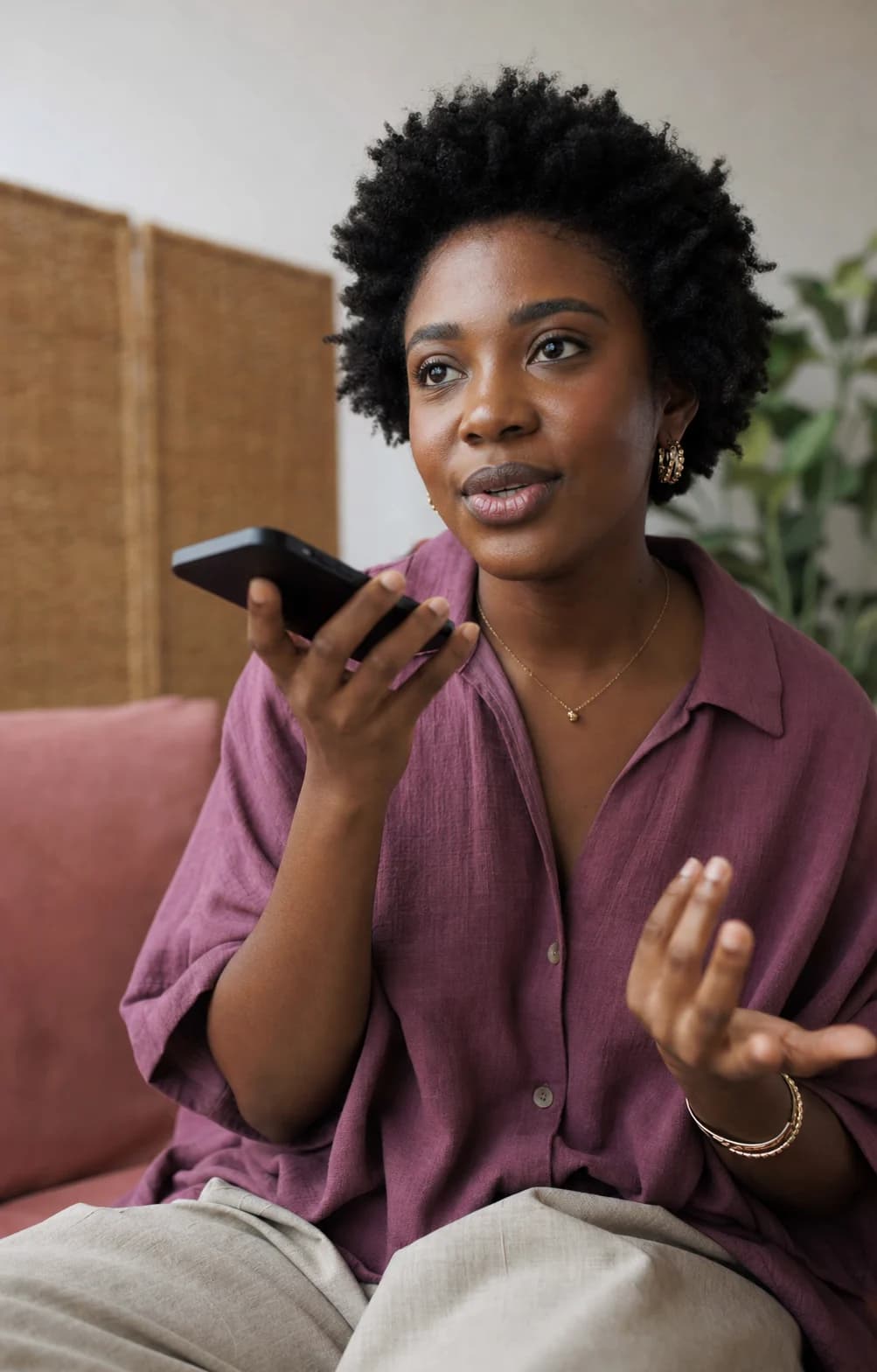 A woman recording a voice introduction at home